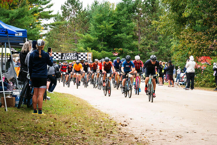 riders start the Hurtin In Haliburton road cycling race