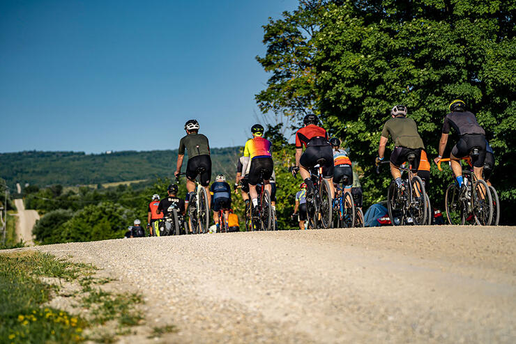 a group of riders crest a small rise on the course of the Sea Otter Canada road cycling race