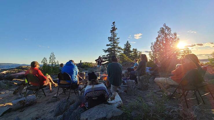 people sitting in wilderness