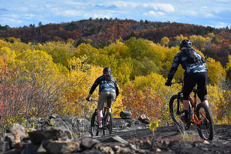 two cyclists ride at the Walden Mountain Bike park near Sudbury