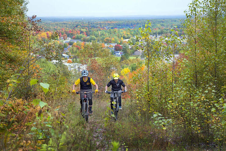 two cyclists ride up the Laurentian Escarpment