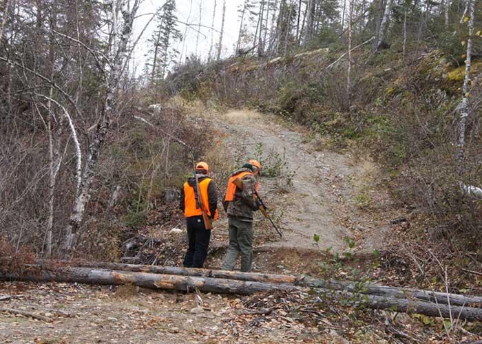 2 hunters in orange and cammo