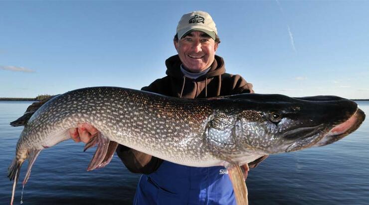 gord pyzer holding an ontario northern pike