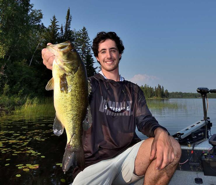 angler holding bass