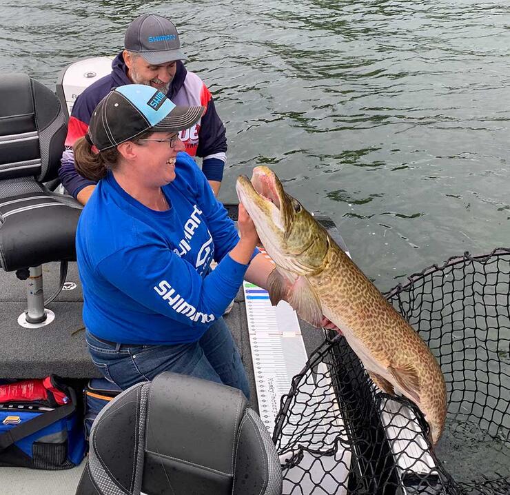 anglers holding musky