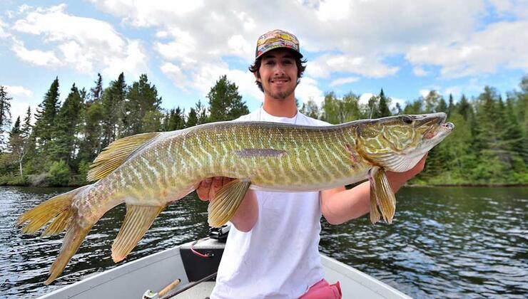 young angler fishing muskie