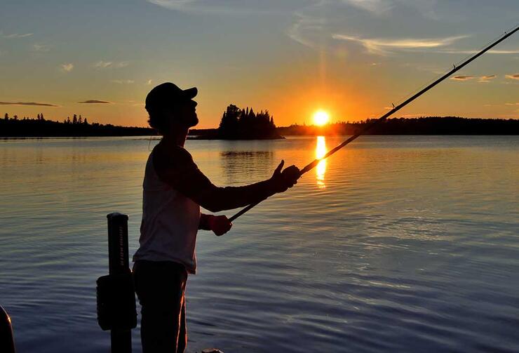 young angler fishing with muskie rod