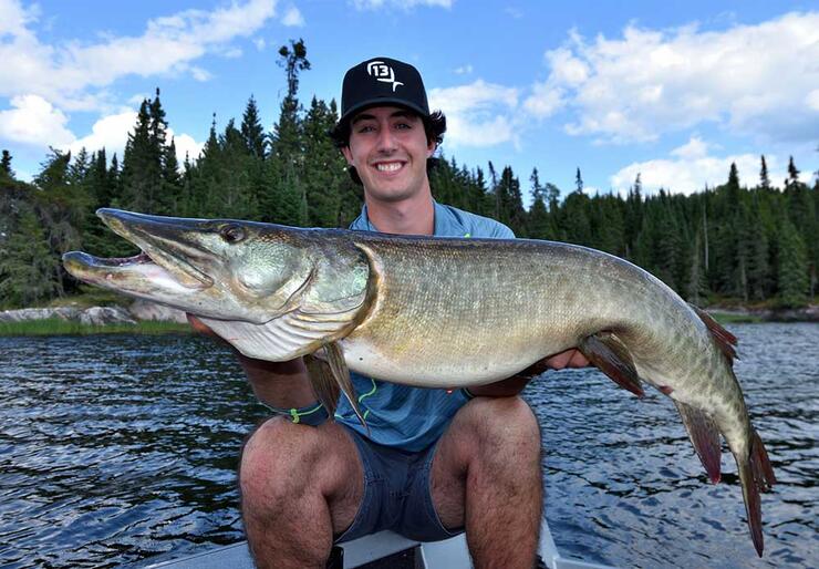 young angler fishing muskie