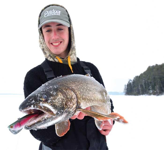 young angler with lake trout