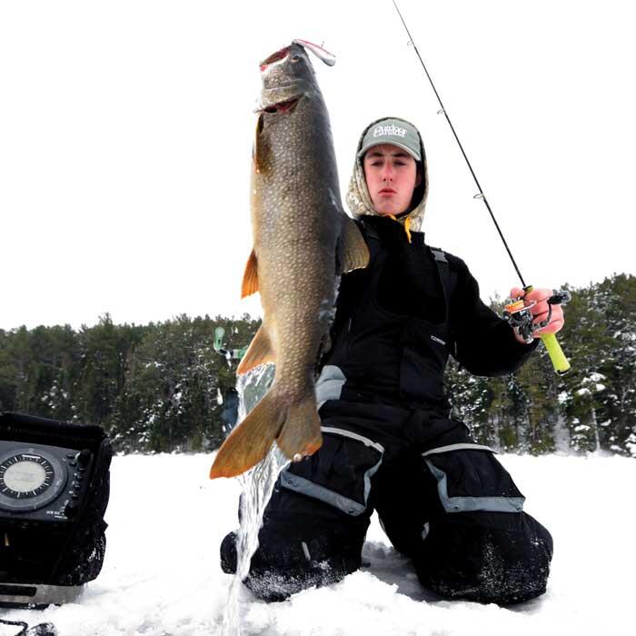young angler with lake trout