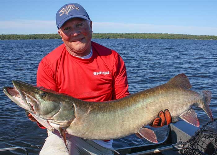 angler holding muskie