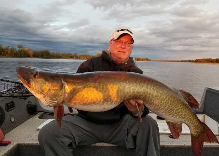 angler holding muskie