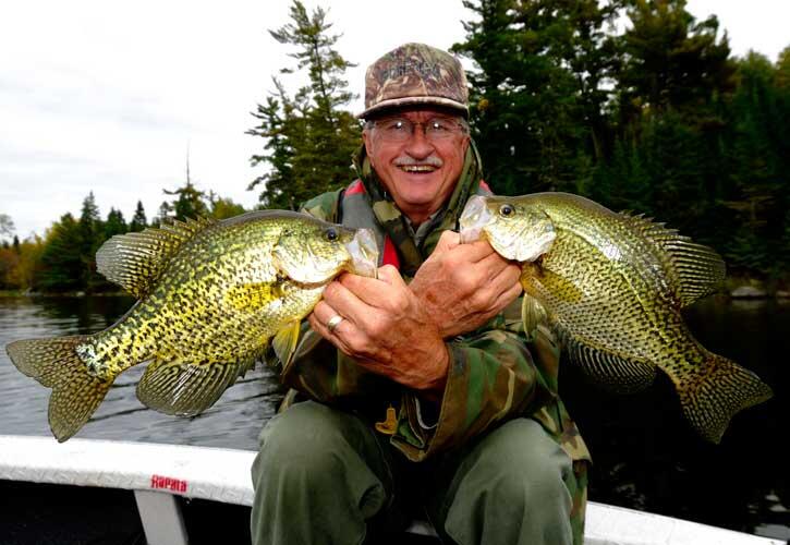 angler with 2 black crappie fish