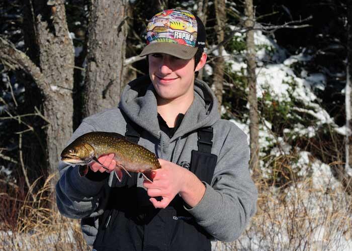 young angler with trout