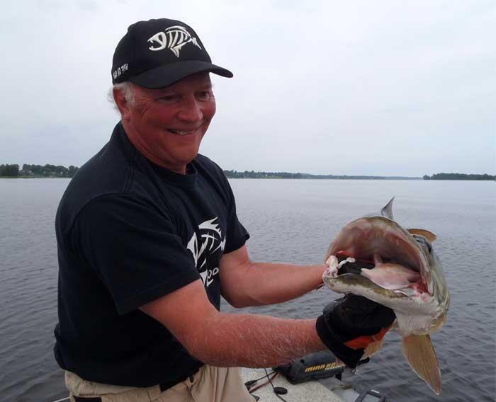 angler holding muskie