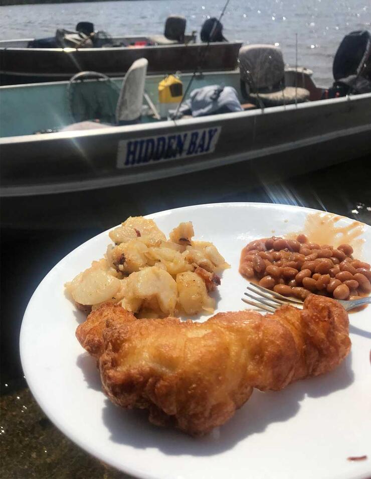 fried fish, brown beans, potatoes