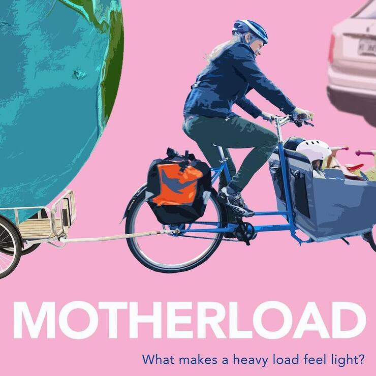 Person on a hike with trailer and kids in carrier