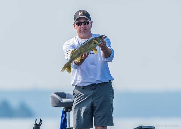 angler with walleye