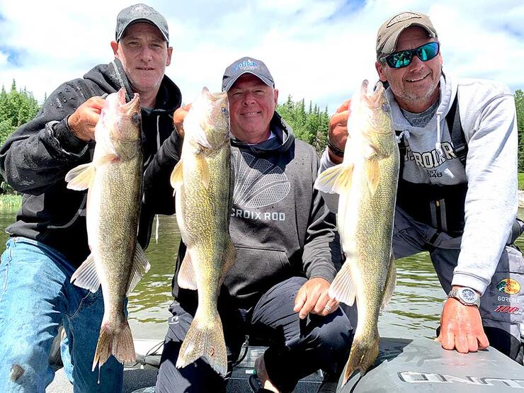 anglers with walleye