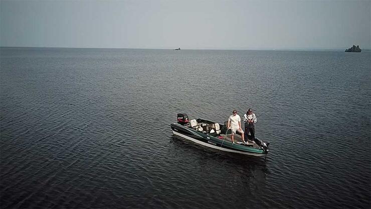 anglers in boat on lake