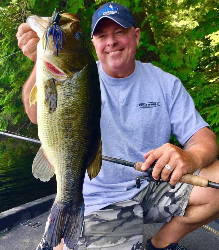 angler holding ontario bass