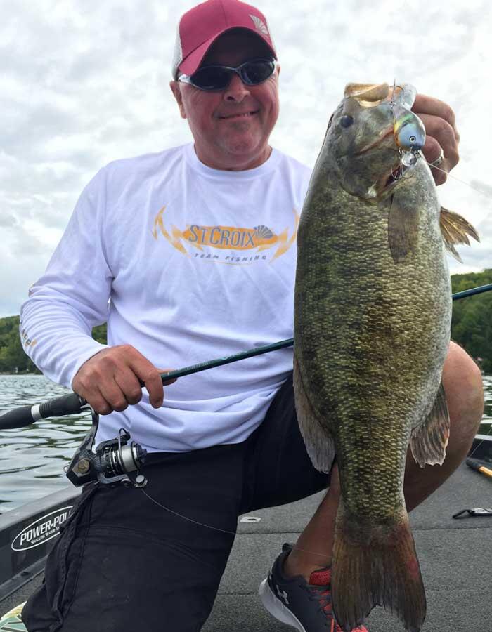 angler with big smallmouth bass