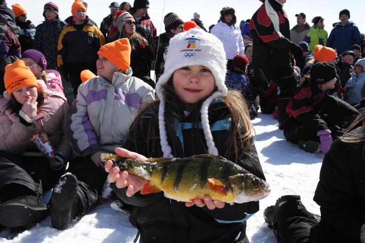 child angler holding perch