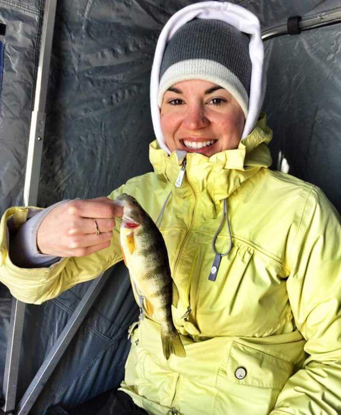 woman angler holding perch