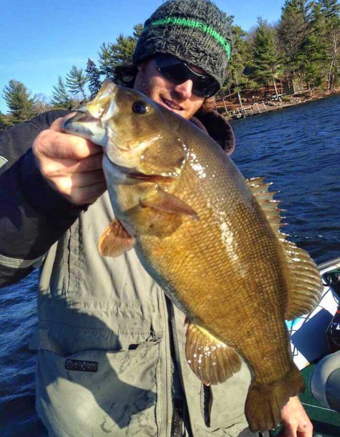 tyler dunn with smallmouth bass