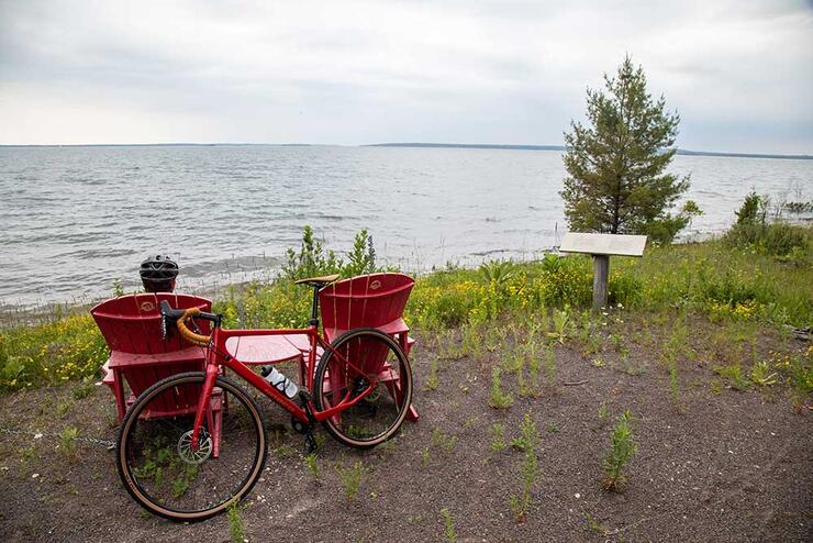 red chairs, lake and bicycle