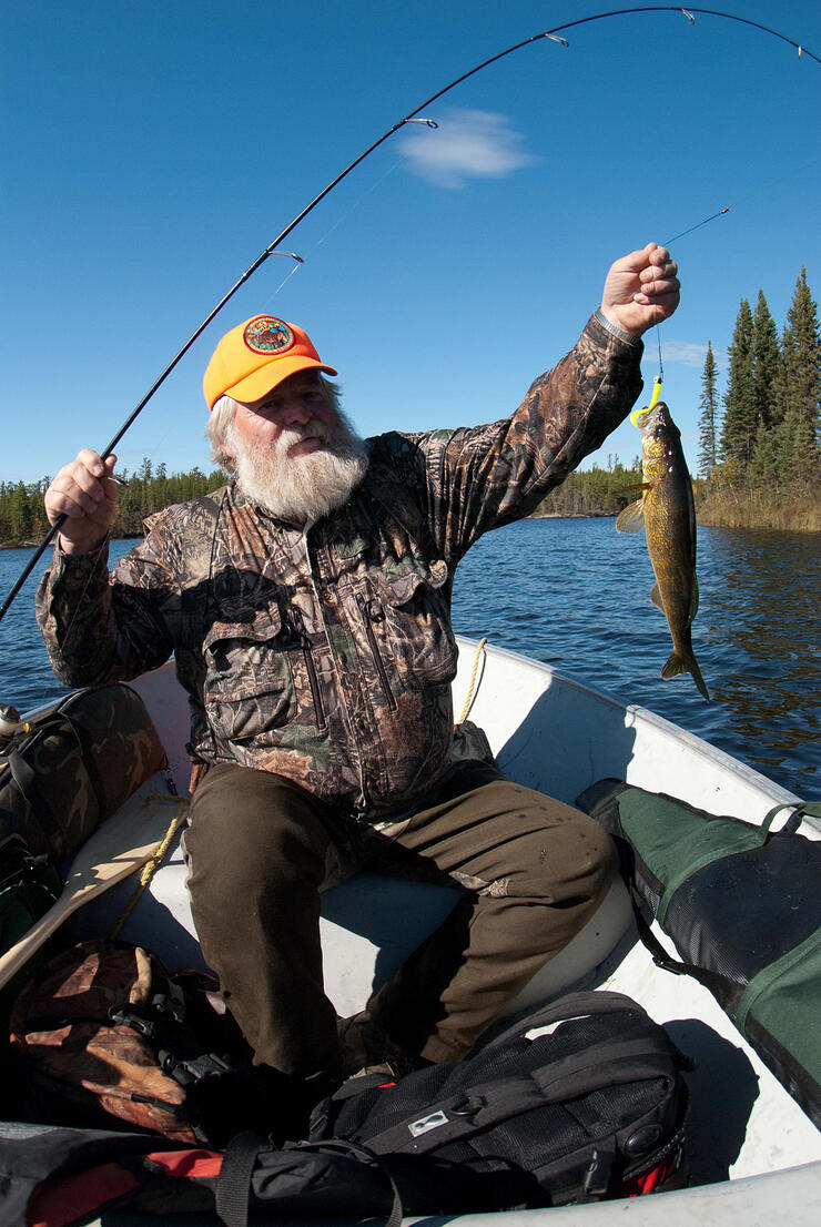 man fishing in a boat