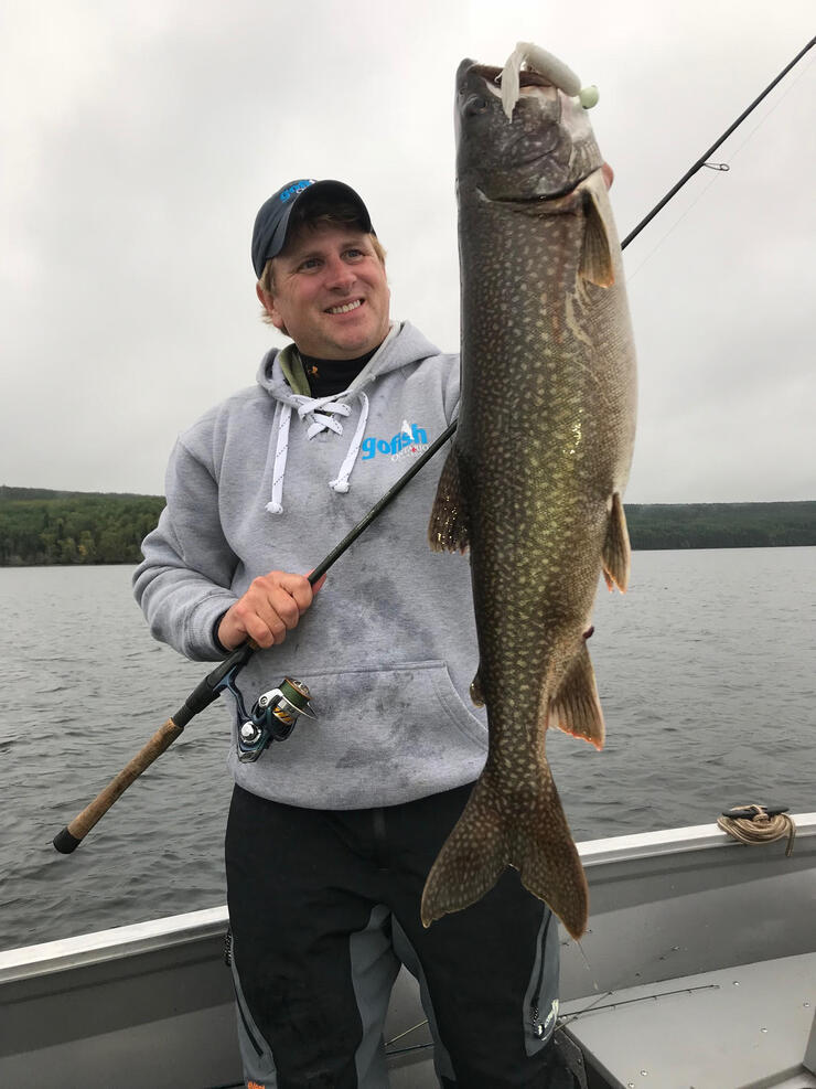 angler holding lake trout