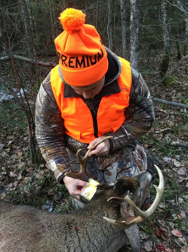 hunter with harvested deer