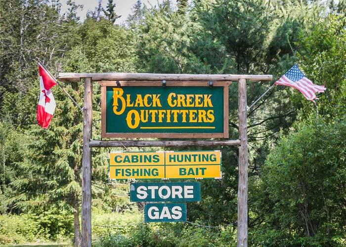 black creek outfitter sign