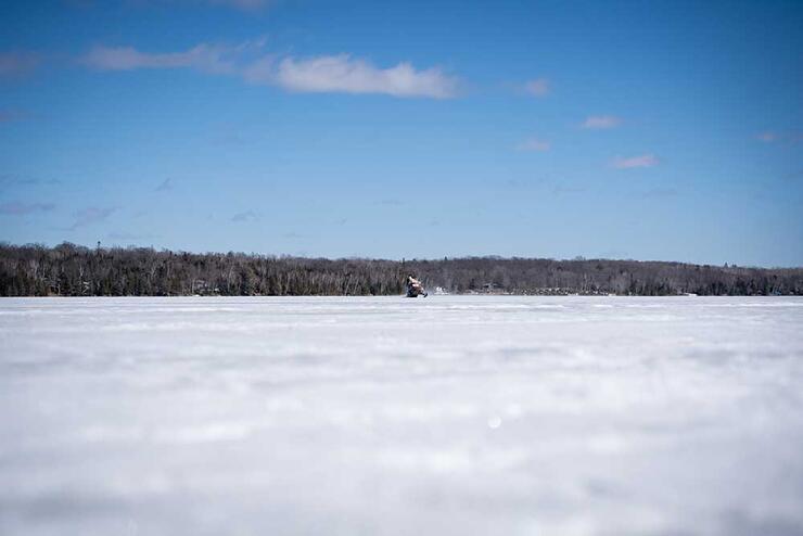 snowmobile on a frozen lake in winter