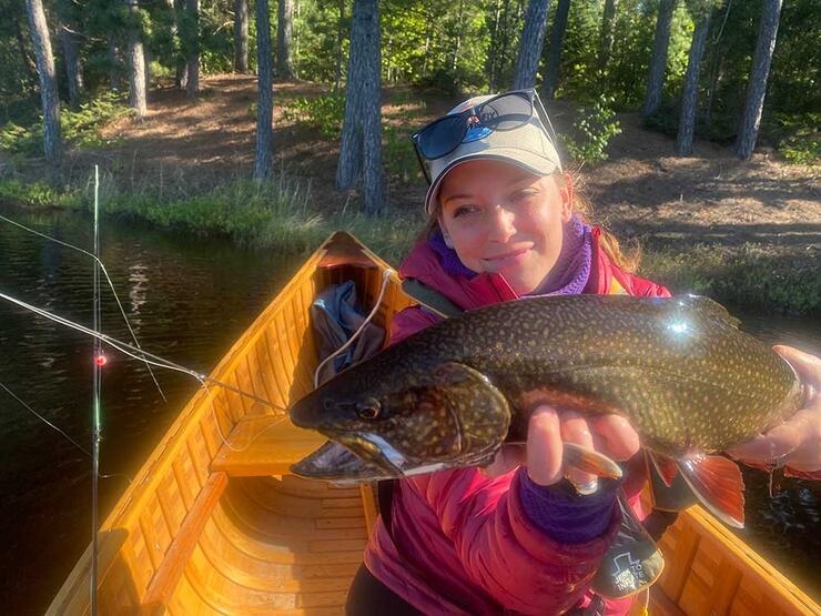 angler holding brook trout 