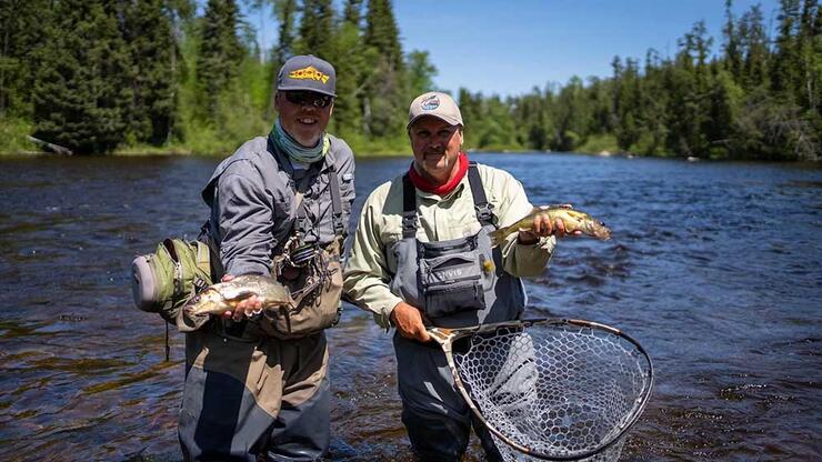 two anglers walleye fishing in river