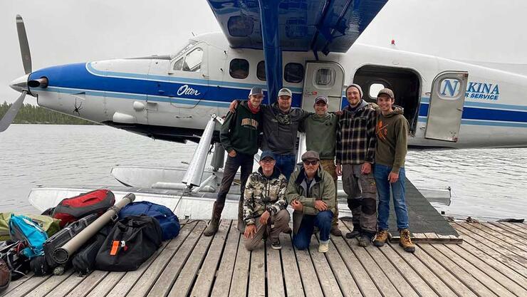 anglers on dock with floatplane