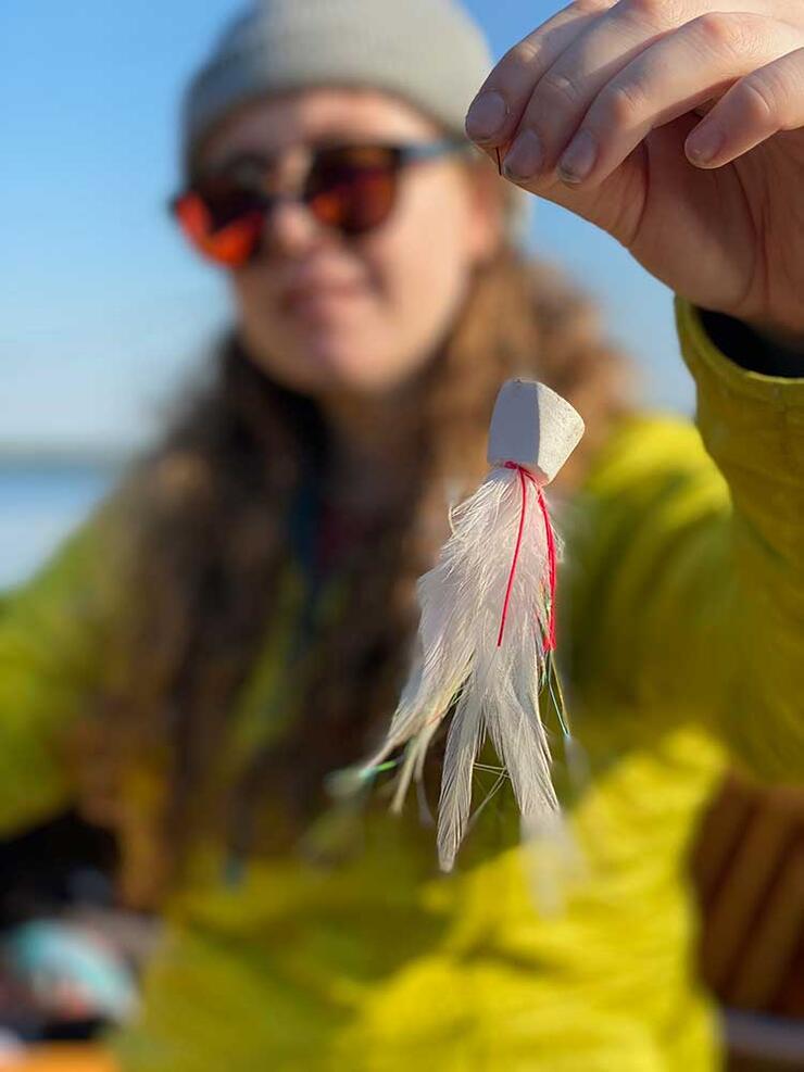 woman angler with fishing fly