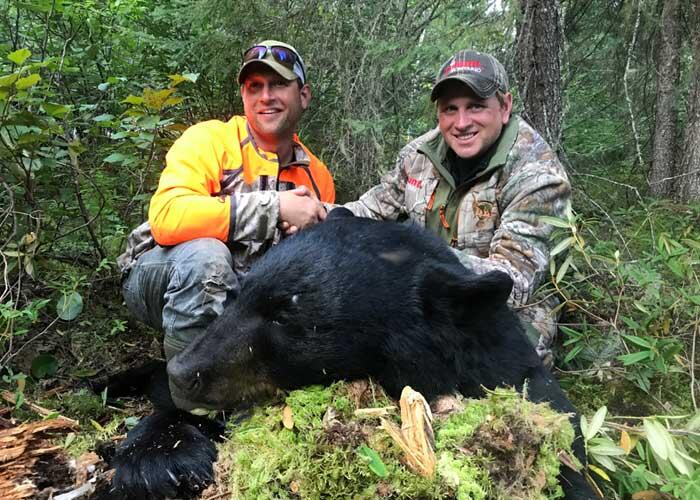 hunters with harvested black bear