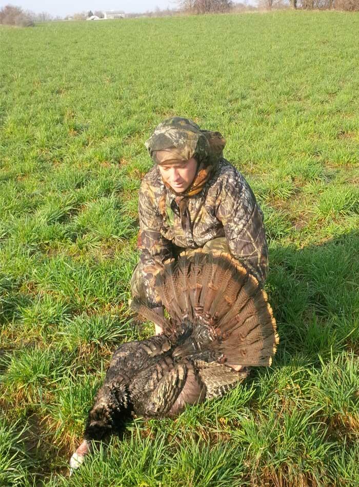 hunter with harvested ontario turkey