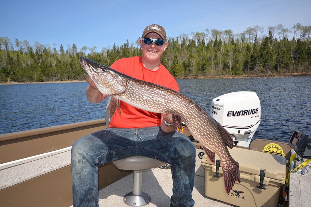 Man with a Big Pike Caught on a Fishing Trip